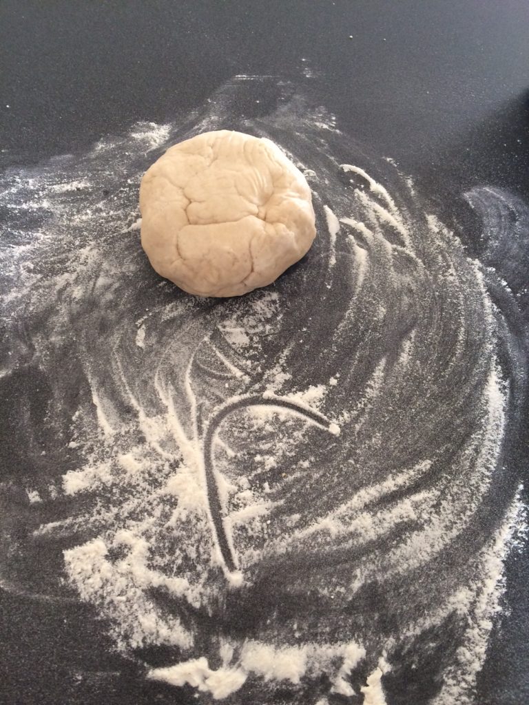 Ball of dough ready to be placed in plastic bag